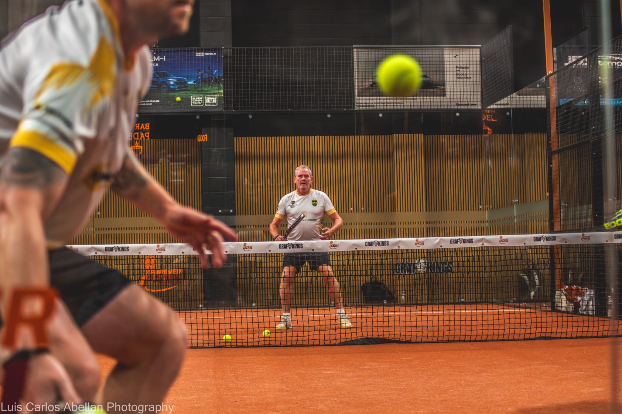 Padel doubles players during a rally