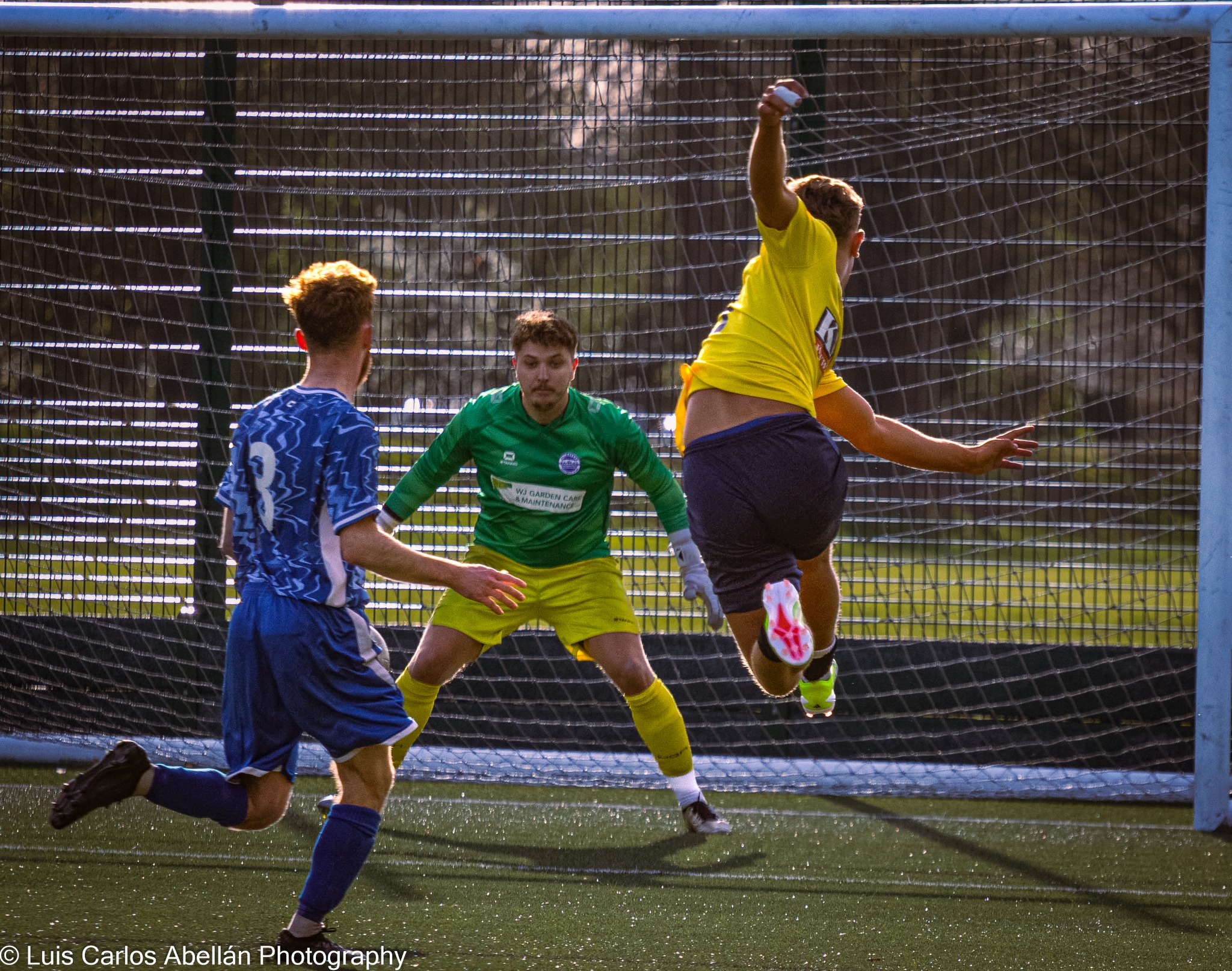 Footballer shooting at goal during a match